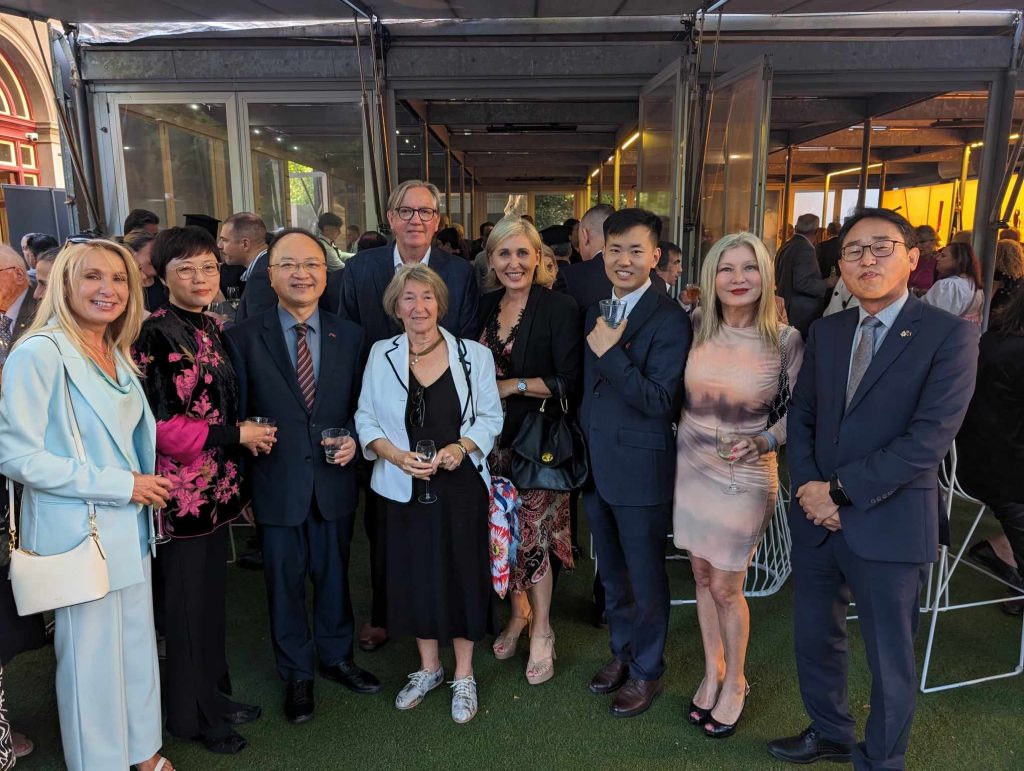 Betty Dimitropoulos and Denise Zapantis with the Consul Generals and Ambassadors of the People's Republic of China, Slovakia, Italy, Germany, Japan and Korea. Together they said, 'Zito i Ellas'.
