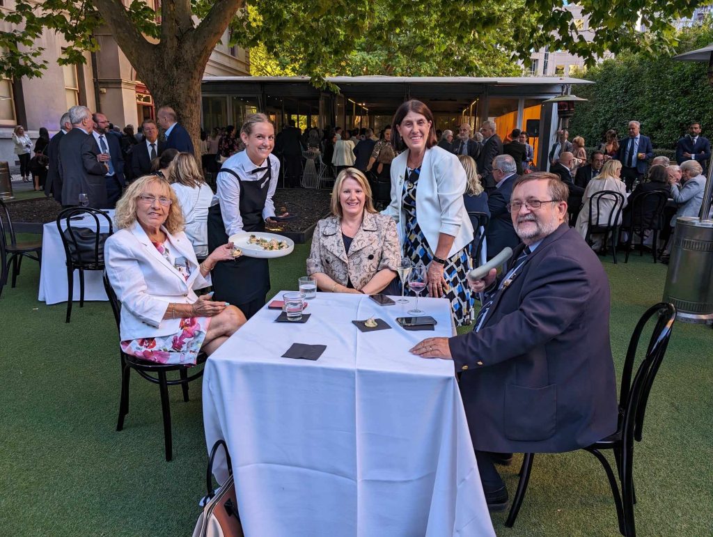 Sofia Mastoris, outgoing president of the Hellenic Women's Association, current Hellenic Women's Association President Mary Lalios, Anemones President Nola Radiotis and Ange Kenos are served appetisers.