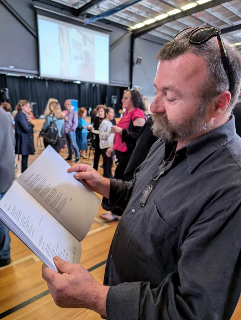 JayZed admires his first published poem in the Antipodes Periodical