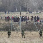 immigrants-refugees-greek-turkish-border-kastanies-evros-greece-march-greek-police-soldiers-front-fence-174658146