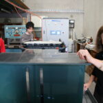 2007-V-Fuel-Lab-photo-of-Maria-showing-a-5-kW-vanadium-battery-prototype-with-Michael-and-George-Kazacos.