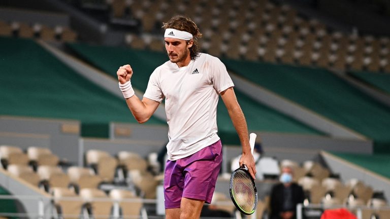 Tsitsipas conquers Isner as he prepares to face Busta in French Open