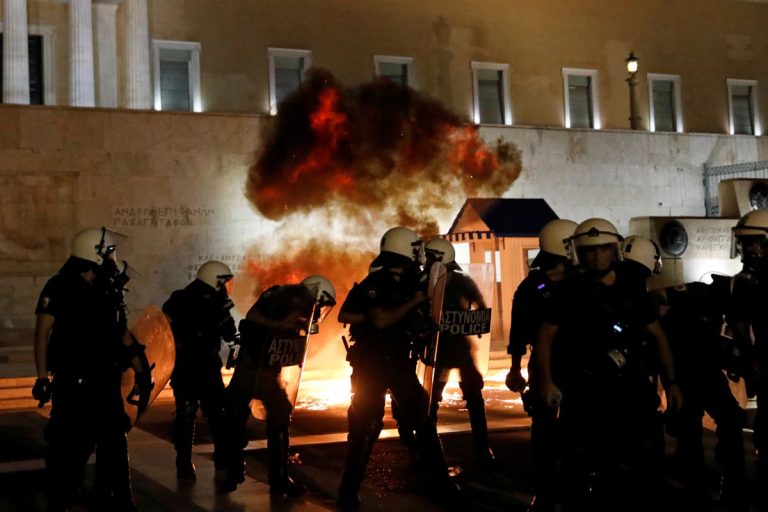 Greek police clash with protesters in rally against mandatory vaccinations