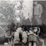 Nikolaos-and-Anastasia-Tsakonas-and-pet-Dog-Liza-parents-of-Drosoula-family-friend-at-doorway-circa-1956