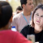 Foreign-Minister-Annalena-Baerbock-in-conversation-with-refugees-in-the-Schisto-refugee-camp