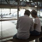 Senior couple traveling airport scene