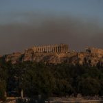 Smoke from a fire blanketed part of the Athenian sky as it is seen behind the ancient Acropolis hill with the Parthenon temple on Tuesday Photo AP News AP PhotoPetros Giannakouris
