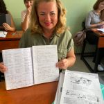 GCR-photo-Ukranian-refugee-student-displays-her-progress-in-learning-to-write-in-Greek