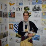Martha-Stamatopoulos-18-in-front-of-some-of-the-childrens-artworks-featured-in-the-Childrens-Competition-to-be-judged-on-29-May.