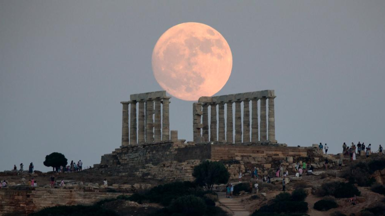 Buck supermoon dazzles Greece but hidden by clouds in Australia
