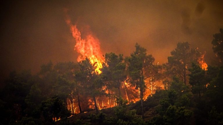 Raging wildfires force evacuation of villages in northern Greece