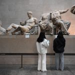 Visitors view the Parthenon Sculptures, also known as the Elgin Marbles, at the British Museum in London. Photo CNN.