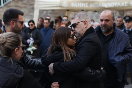 Karras' daughter at her father's funeral service. Photo iefimerida.