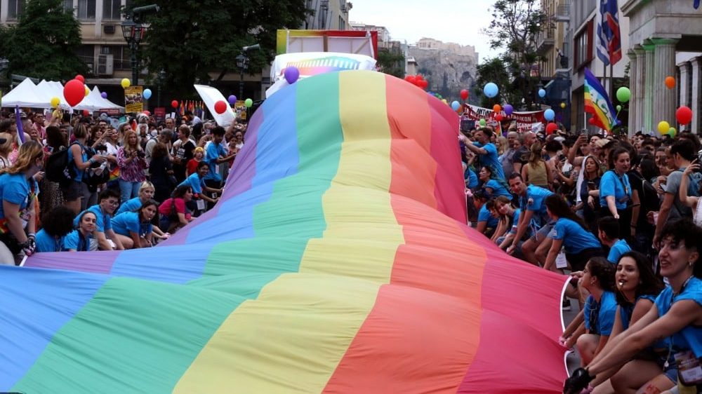 People hold a giant rainbow flag, as they participate in the annual Gay Pride parade known as Athens Pride in Athens, Greece, 10 June 2023. Photo EPA EFE ALEXANDER BELTES.