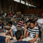 Rescued migrants at the port of Kalamata following a rescue operation Photo yahoo news.