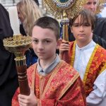 Altar boys lead the way for the priests and bishops to follow