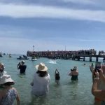 Crowds viewed the ceremony from the Pier and in the water.