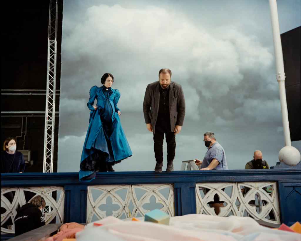 Poor Things director Yorgos Lanthimos joined by his star, Emma Stone, on set. Photo Vanity Fair Atsushi Nishijima.