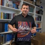 Nick Dallas holds up the poster of the Antipodes Festival. Photo copyright The Greek Herald Mary Sinanidis.