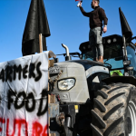 One of the angry farmers who converged on the agricultural fair in Thessaloniki on Thursday. Photo Sakis Mitrolidis AFP.