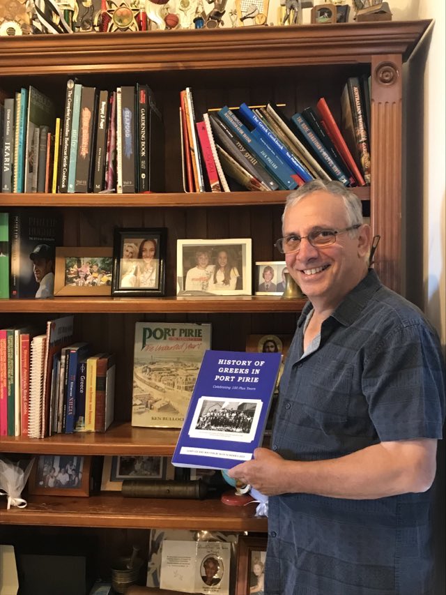 Nick Seindanis with his book.