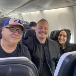 Angelo Tsarouchas on plane with Frank Spadone and Arianna Papalexopoulos.