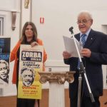Guest speaker Mr. Peter Yiannoudes and Public relations committee member Emily Kazakos displayed the original posters from 1964 for the movie Zorba the Greek_