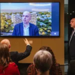 Andreas Kambanellas, Commercial Director Residential at LAMDA Development S.A., taking a question from the audience via video call, at the HACCI National Federation event held in Melbourne.