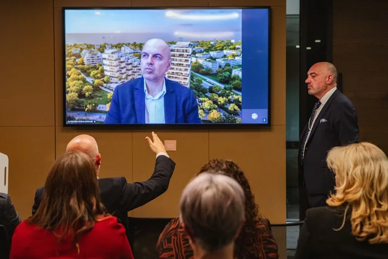 Andreas Kambanellas, Commercial Director Residential at LAMDA Development S.A., taking a question from the audience via video call, at the HACCI National Federation event held in Melbourne.