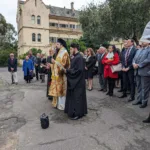 Bishop Evmenios says a prayer ahead of the wreath-laying