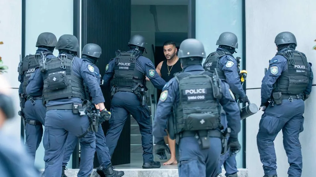 Boulos opens the door to find heavily armed police outside his Picnic Point home. Picture: Thomas Lisson