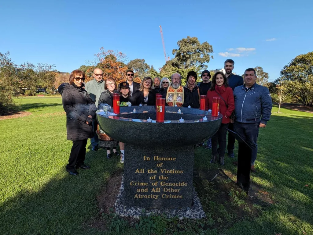 Gathering at the monument, with John Pantazopoulos as MC