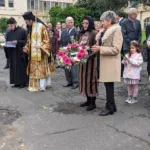 Litsa Athanasiadis lays a wreath for Merimna