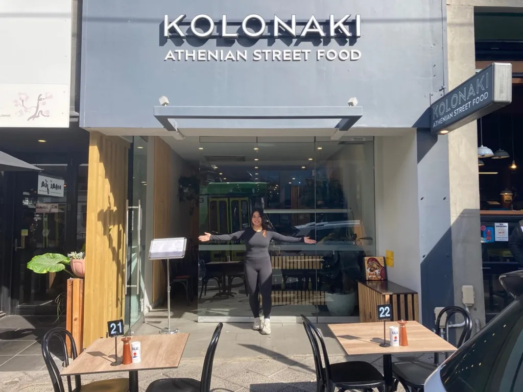 ‘Kolonaki: Athenian Street Food’, 278 Toorak Road, South Yarra – Manageress Britney Liu embracing her new Greek restaurant, with Asian cuisine restaurants on each side.)