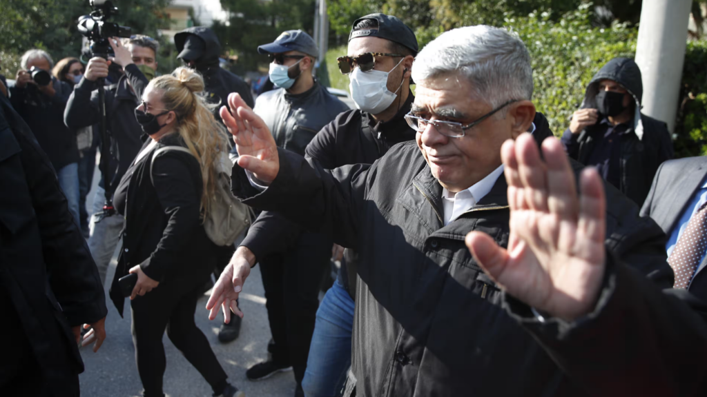Nikos Michaloliakos leaving his house in Athens after his conviction in 2020. Photograph: Thanassis Stavrakis/AP