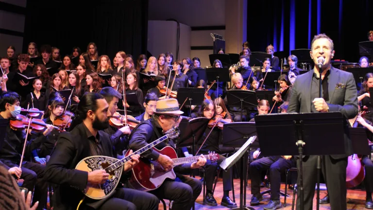 From Greece to Newtown: Dimitris Basis unites with students to sing ‘Music from the Heart’