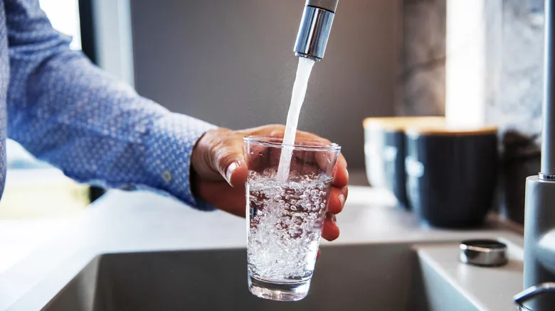 Man Pouring Himself Water