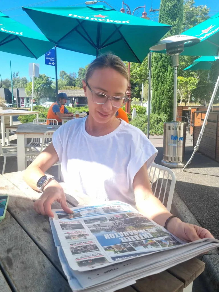 "Antigoni Drisbioti in Melbourne earlier this year reading The Greek Herald. Photo: Bill Roumeliotis'