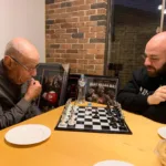 Grandfather Savvas Larcos and Grandson Tim Larcos playing chess in Sydney.