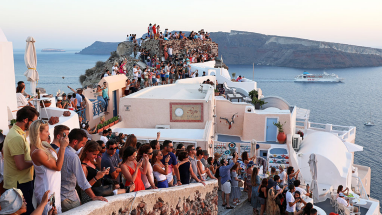 Santorini floods with tourists as locals plea for a limit