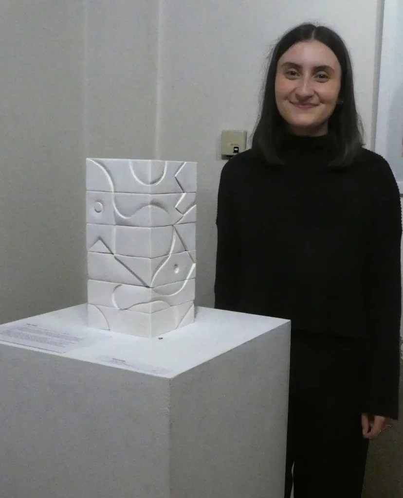 Marie Petridis with her sculpture Abstract Formation