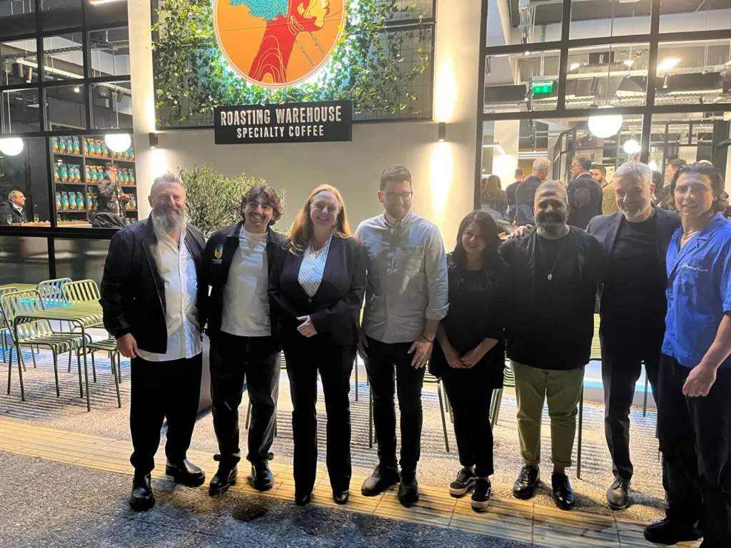 The Greek-Australian businessman, George Paraskevopoulos (left) with his son Alexander (next to him), the Australian Ambassador to Greece, Alison Duncan, the Greek coffee champion, Nikos Antzaras (to the right of the ambassador), and his other son, Jonathan (right).