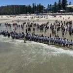 Swimmers lining up, ready to compete for the cross