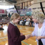 Hon.-Clare-ONeil-congratulates-a-student-leader