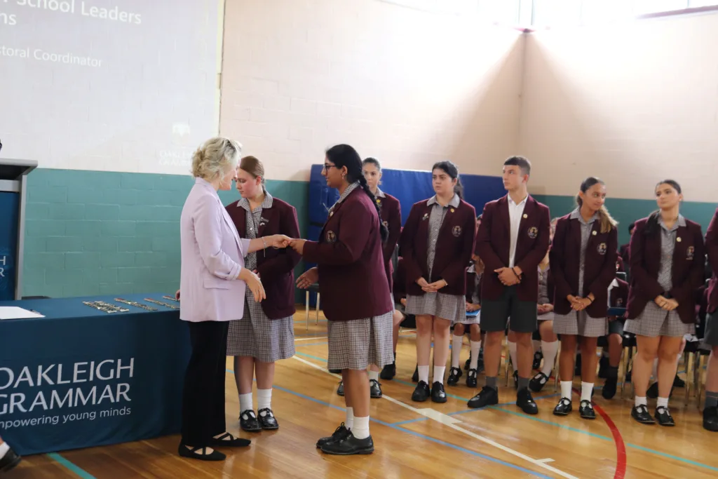 Hon. Clare O'Neil congratulates a student leader