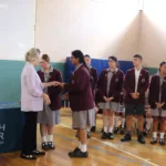 3. Hon. Clare O’Neil congratulates a student leader 2