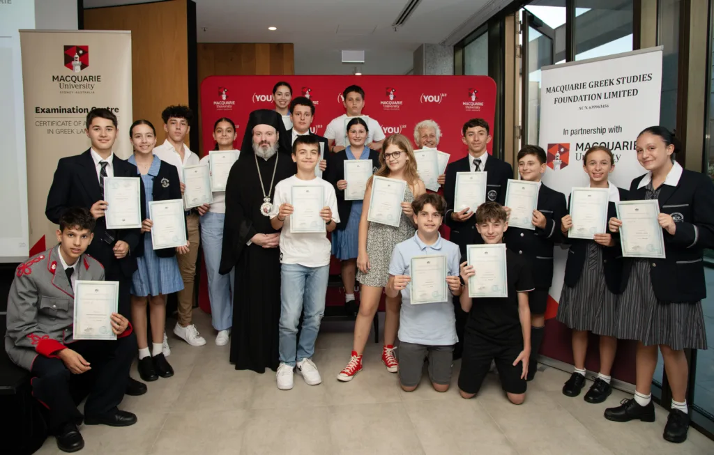 His Grace Bishop Christodoulos of Magnesia, representing His Eminence Archbishop Makarios Primate of the Greek Orthodox Church in Australia with Certificate recipients of A2 level.