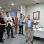 CCMV President Theo Theophanous invites VIP guests to join the rest of those present