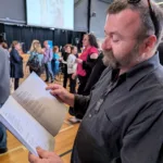 JayZed admires his first published poem in the Antipodes Periodical