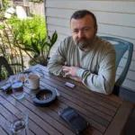 JayZed enjoys a coffee and shares his poetry with me in his backyard